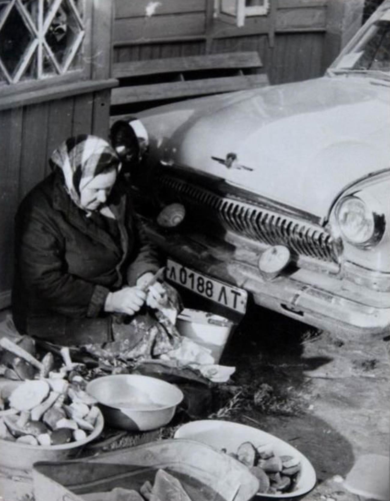 A grandma cleaning mushrooms she just picked  