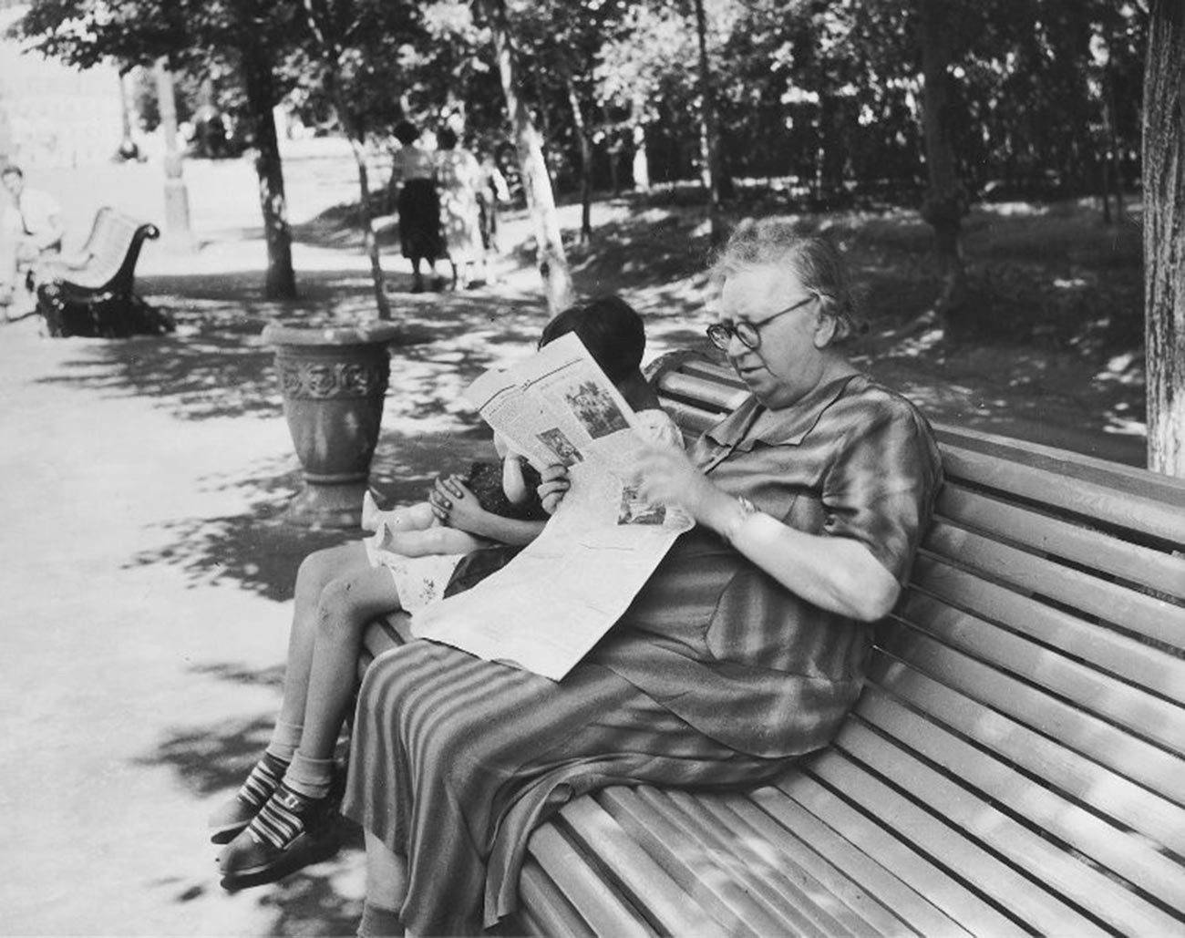 An old woman sitting on a bench, 1956