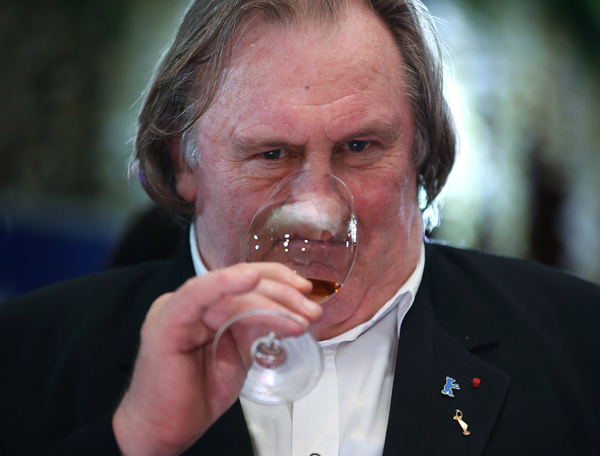 French actor Gerard Depardieu samples wine at a dinner at the Lastochka Restaurant.