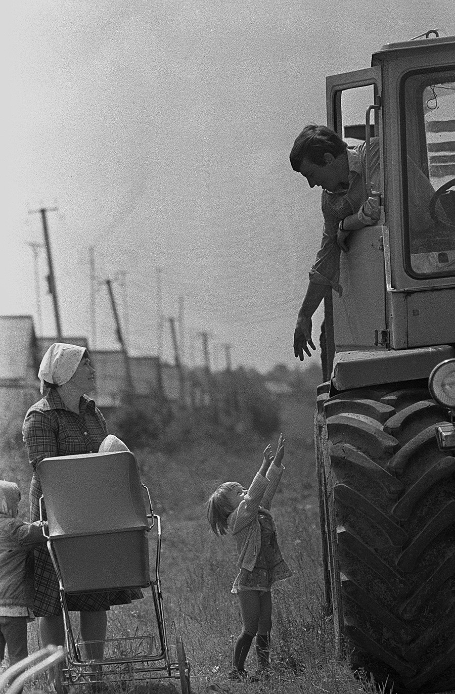 Machine operator at the Soviet Belarus Collective Farm returns home from the field, 1987  