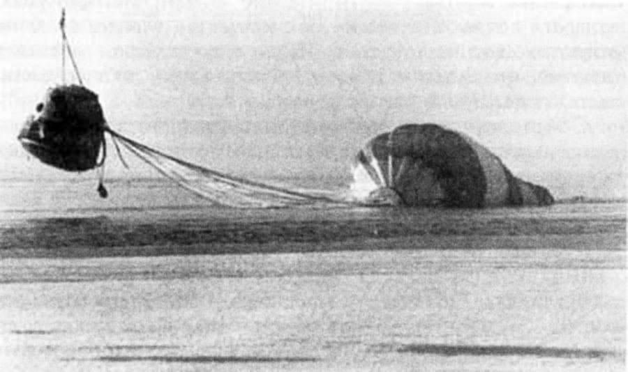 Towing the device with a parachute by helicopter