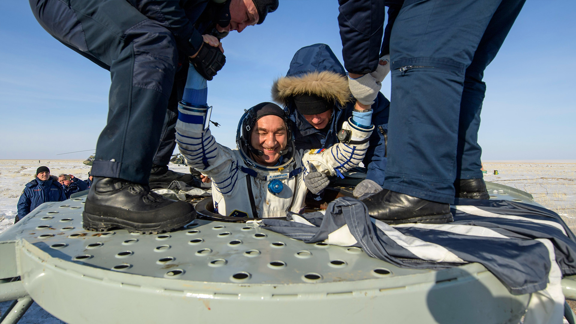 Roscosmos cosmonaut Alexander Skvortsov is helped out of the Soyuz MS-13 spacecraft just minutes after he landed their Soyuz MS-13 capsule in a remote area near the town of Zhezkazgan, on February 6, 2020 in Kazakhstan
