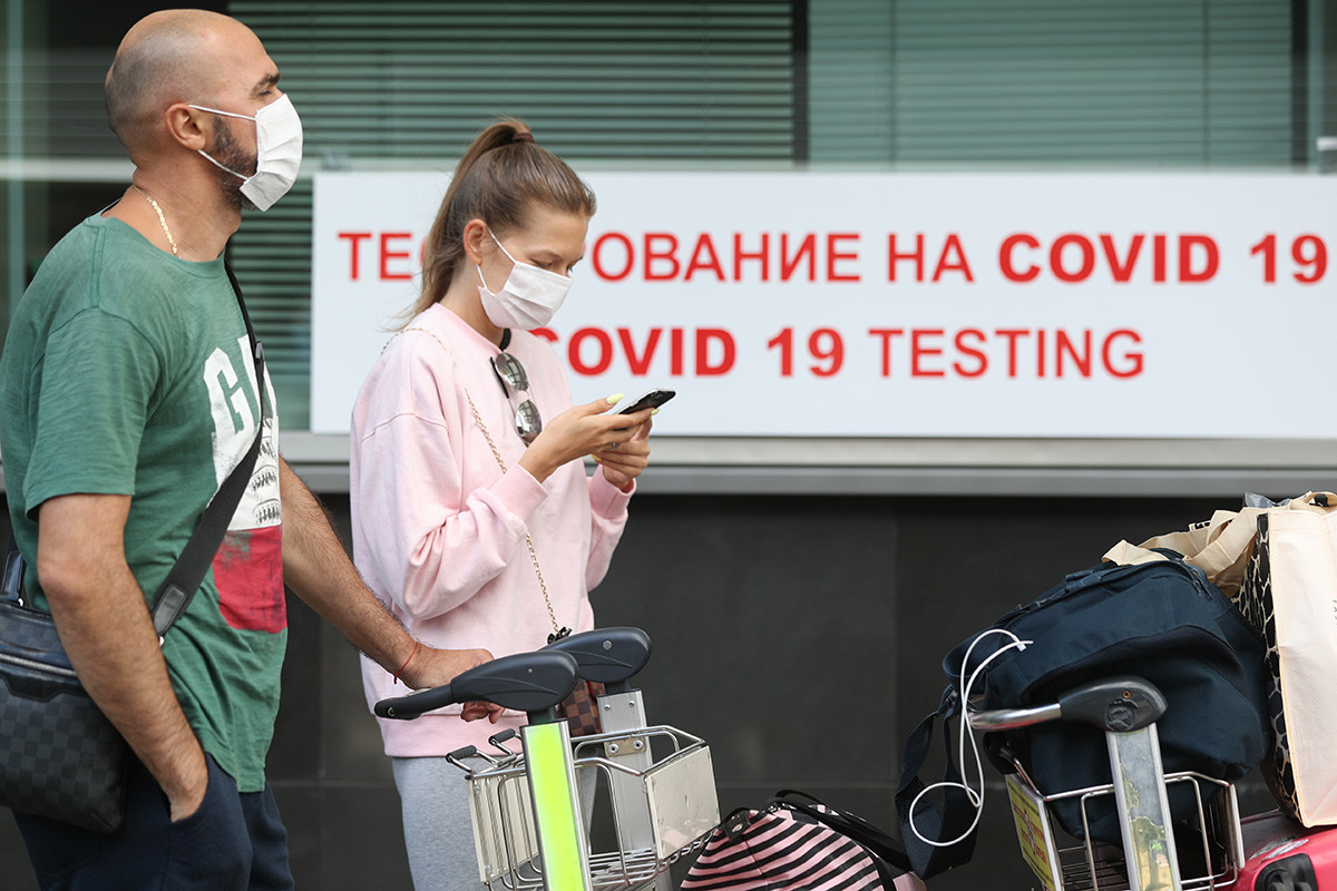 Passengers queue for rapid COVID-19 testing launched at Vnukovo International Airport with the use of testing kits developed by the Russian-Japanese joint venture Evotech-Mirai Genomics. The results are issued in 60min in Russian and English, August 7,2020