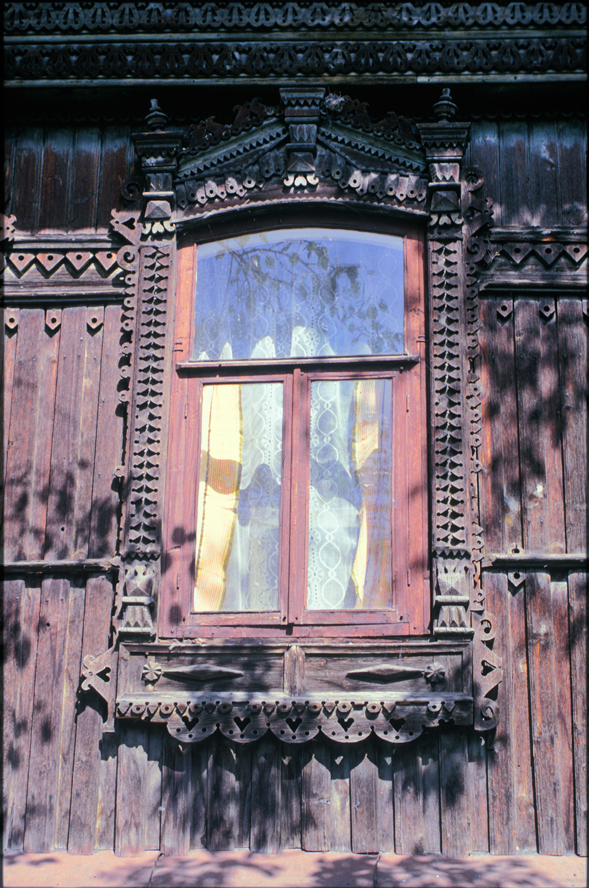 Window with decorative surround, Soviet Street 107. July 15, 2003 