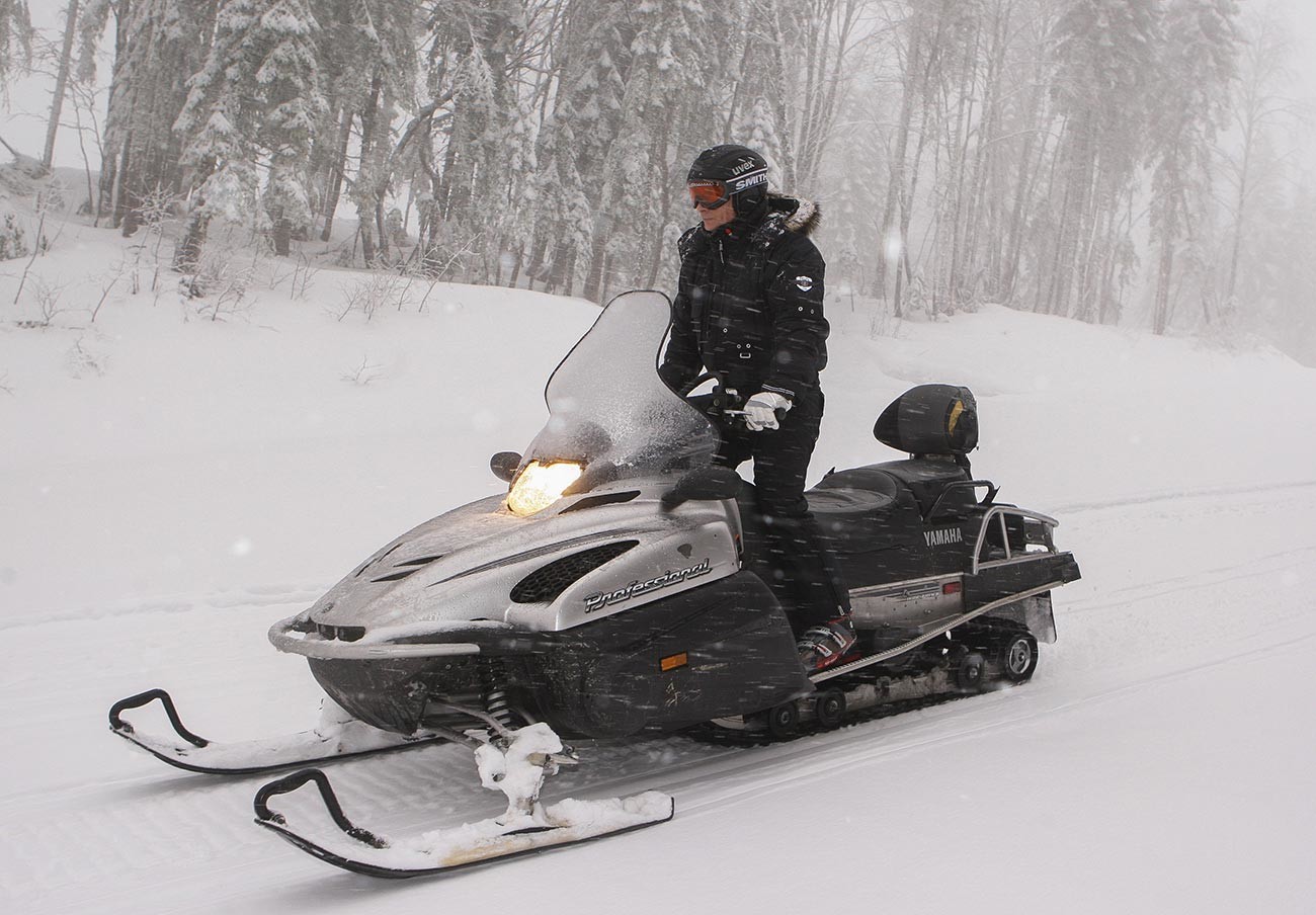 Vladimir Putin drives a snowmobile at Russia's ski resort Krasnaya Polyana near Sochi
