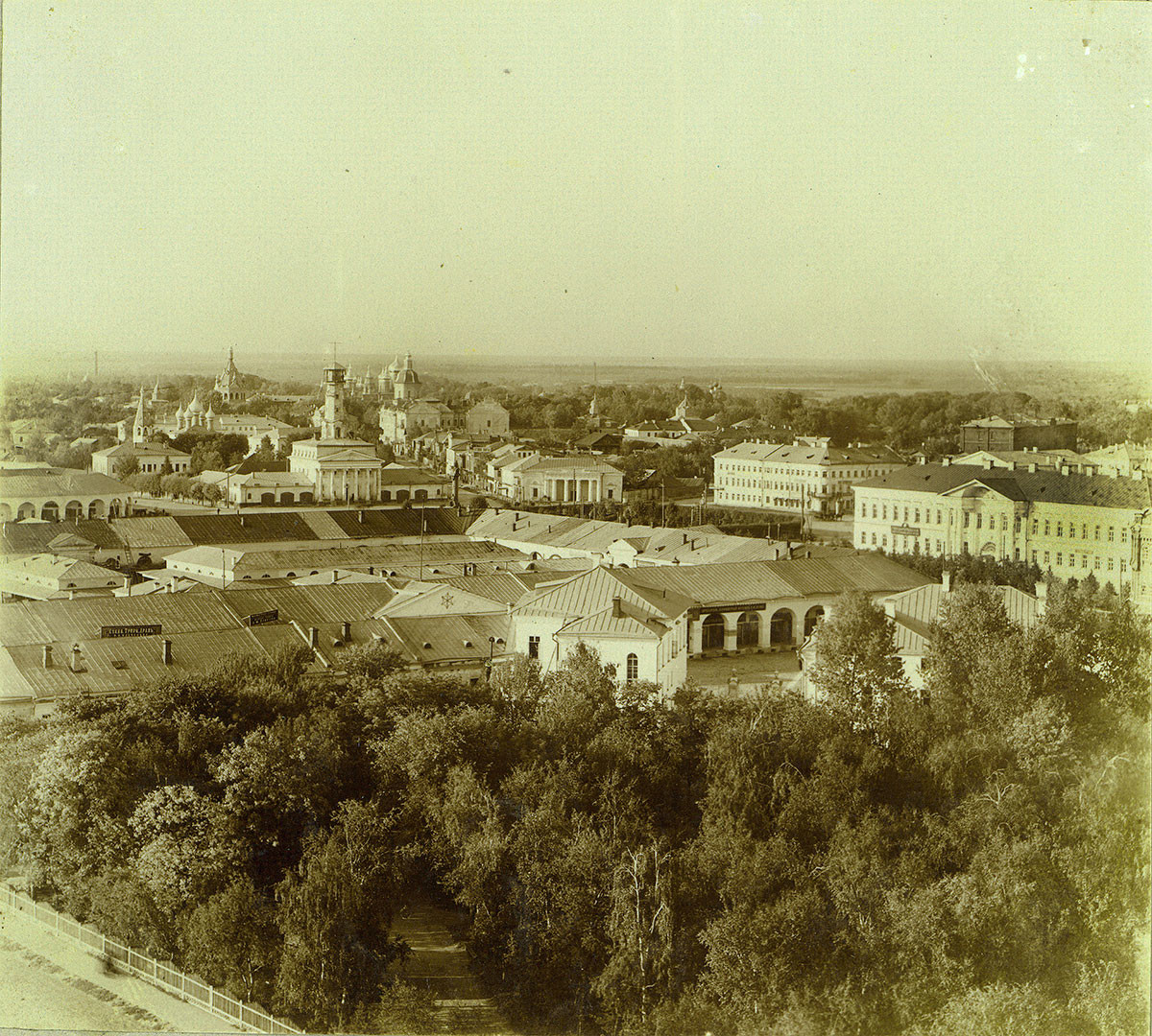 Kostroma. View of Susanin Square from bell tower of Epiphany Cathedral (demolished in 1934). Upper right: Epiphany Street leading to Epiphany Convent. Center: Fire tower on Susanin Square. Foreground. Large Flour Trading Rows. Summer 1910