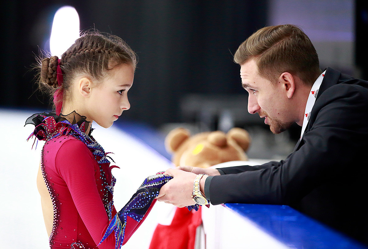 Choreographer Daniil Gleikhengauz talks to Anna Shcherbakova of Russia before her junior ladies free skate during the 2018 Junior Grand Prix of Figure Skating on September 14, 2018 in Richmond, British Columbia, Canada