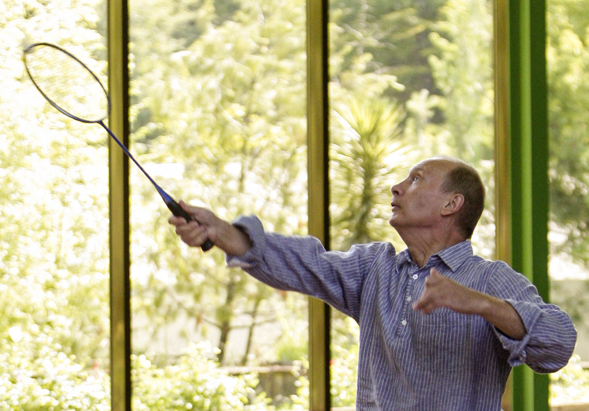 Russia's Prime Minister Vladimir Putin plays badminton with President Dmitry Medvedev during their meeting in the official vacation residence of Bocharov Ruchei in the Black Sea resort of Sochi, August 14, 2009