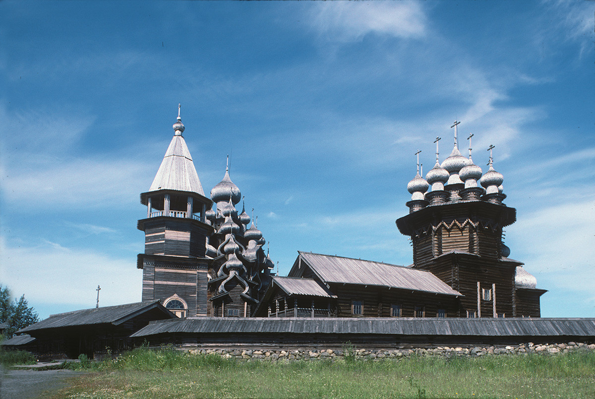 Kizhi pogost. South view with fieldstone wall. From left: bell tower, Church of the Transfiguration (in background), Church of the Intercession. July 13, 1993