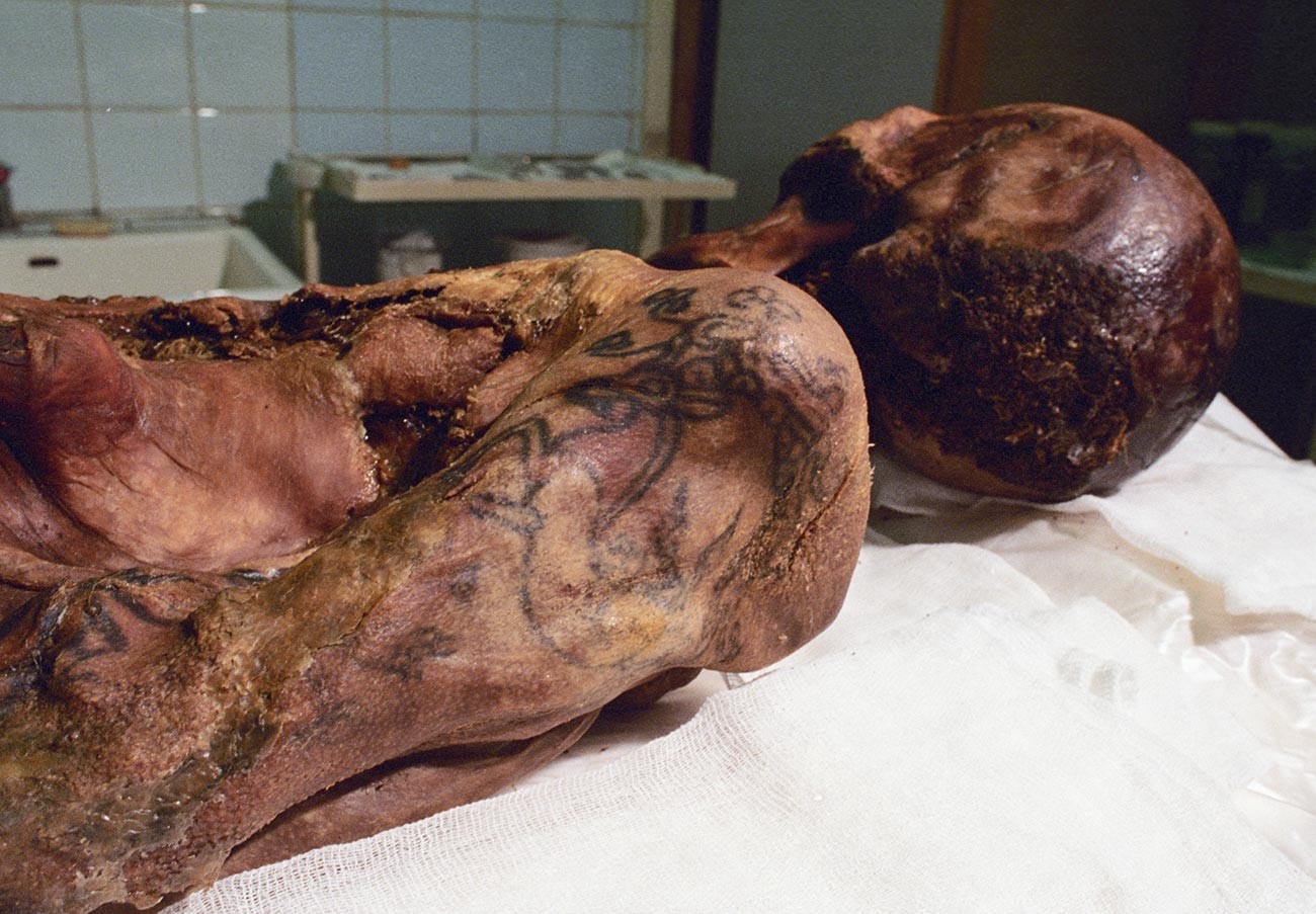 The carcass of the 'Siberian Ice Maiden,' with her tattooed arm visible.