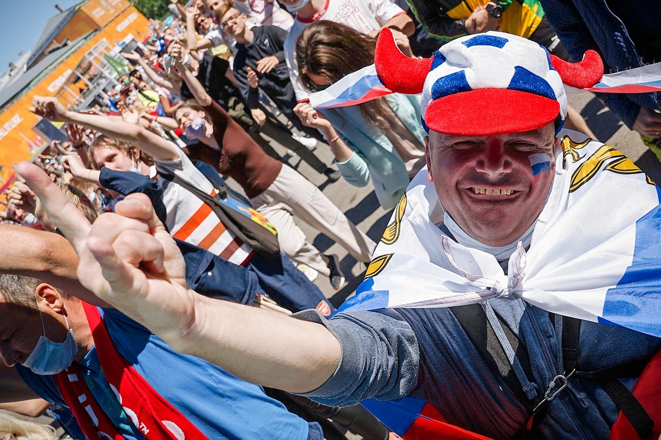 Fans during the broadcast of the match of the 2nd round of the group stage of the European Football Championship 2020 between the national teams of Finland and Russia in the UEFA Euro 2020 football village in St. Petersburg