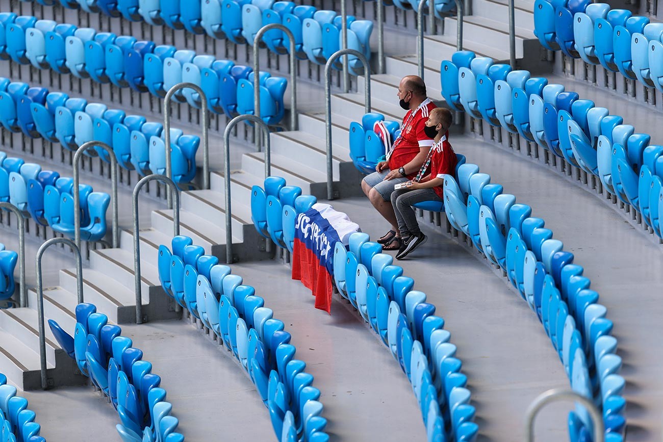 Russia fans wearing face coverings wait in their seats prior to the UEFA Euro 2020 Championship Group B match between Finland and Russia at Saint Petersburg Stadium on June 16, 2021 in Saint Petersburg, Russia