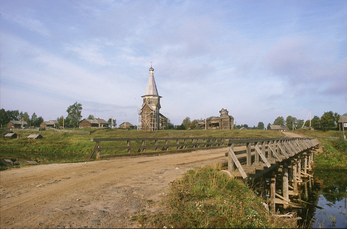 Saminsky Pogost. View of Church of Elijah the Prophet from wooden bridge across Samina River. August 28, 2006