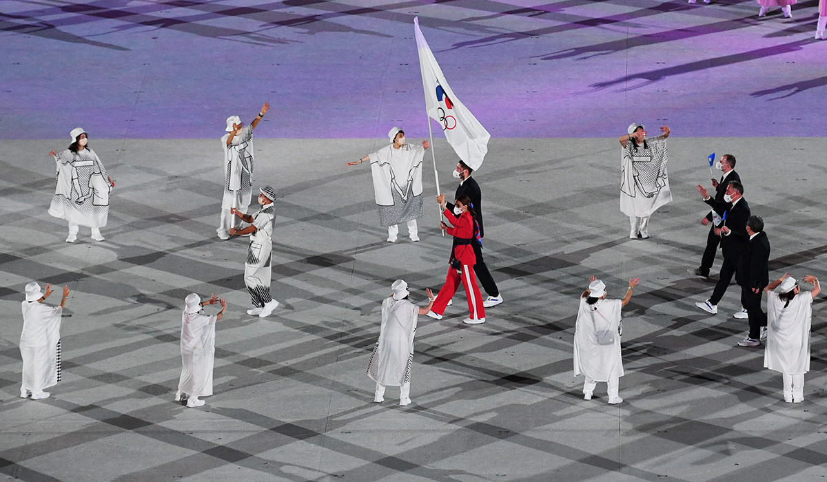 Flag-bearers Sofya Velikaya and Maxim Mikhaylov of the Russian Olympic Committee team lead their country's contingent during the opening ceremony of the Tokyo 2020 Olympic Games