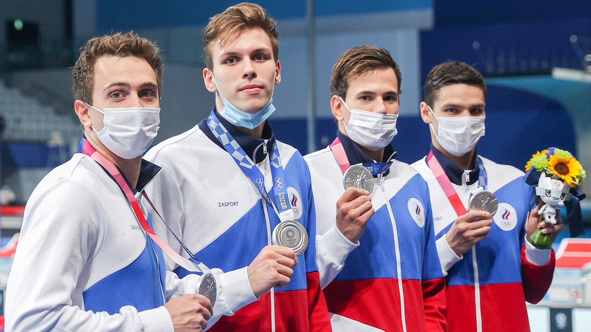 ROC swimmers pose with their silver medals during the victory ceremony for the men's 4x200m freestyle relay final at Tokyo Aquatics Centre during the 2020 Summer Olympic Games