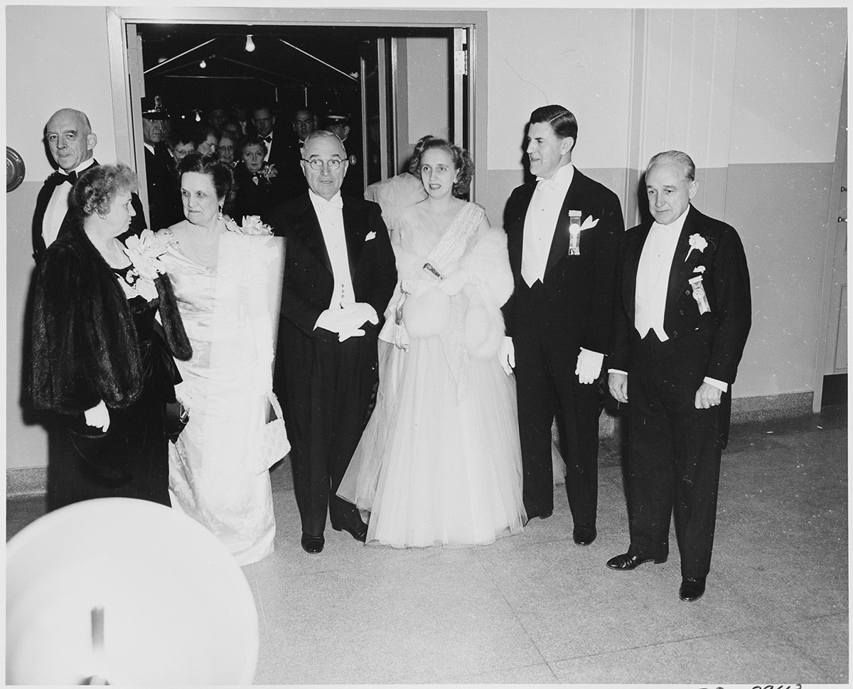 Ms. Perle Mesta (second from the left) and President Harry S. Truman (in the center) at the 1949 Inaugural Ball at the National Guard Armory, Washington, D.C. 