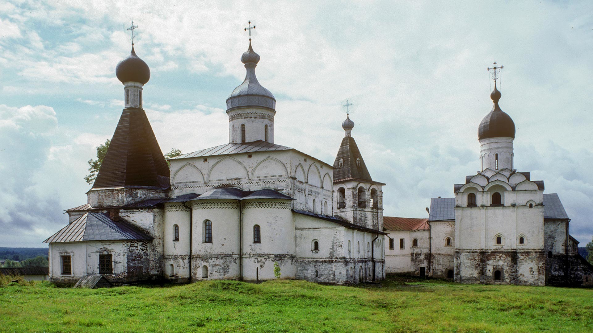 Ferapontov Monastery, east view. From left: Church of St. Martinian, Cathedral of Nativity of the Virgin, bell tower, refectory & Annunciation Church. August 10, 1995