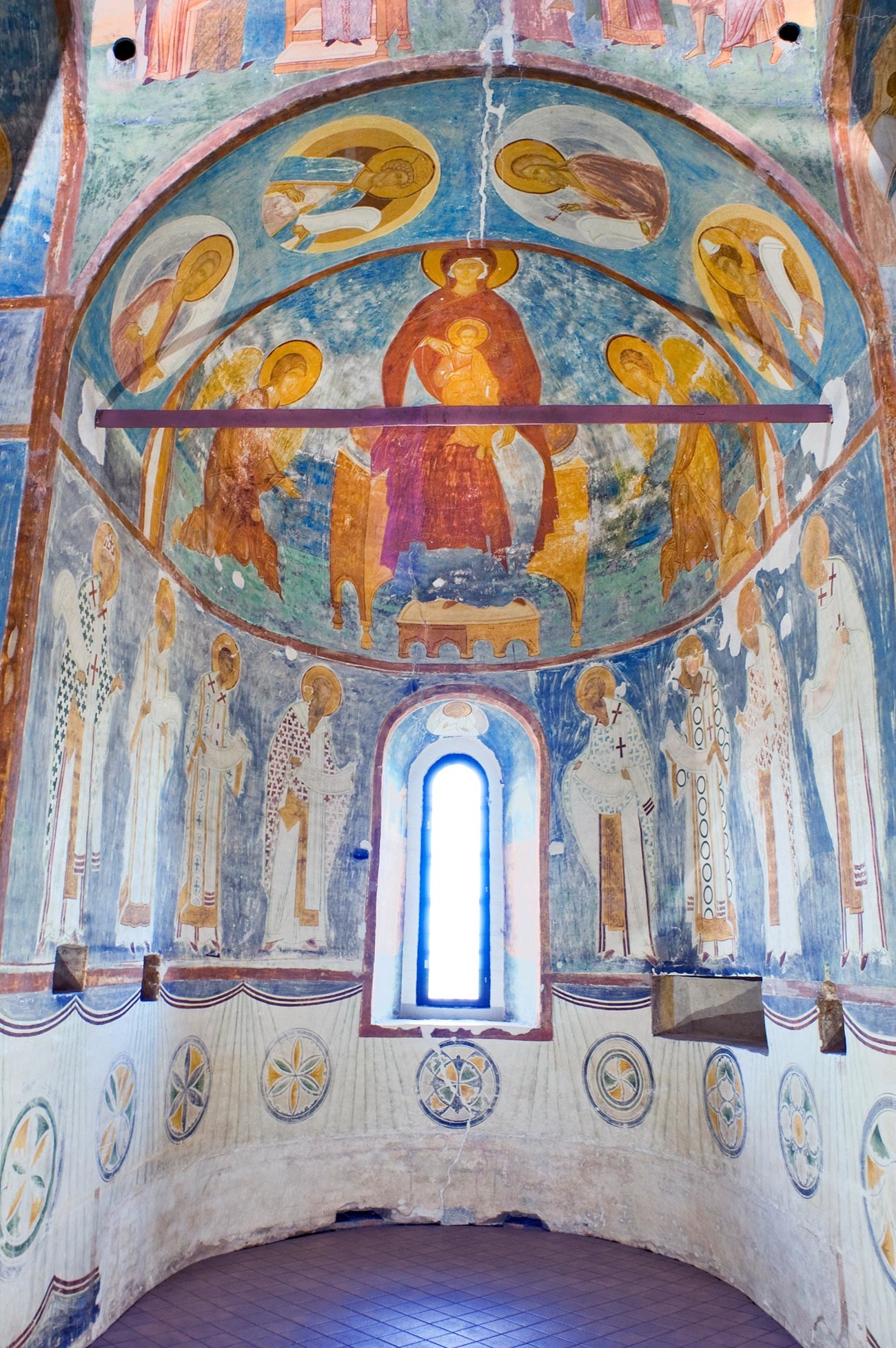 Cathedral of Nativity. Central apse (for main altar). Fresco of Mary enthroned with Archangels Gabriel & Michael. Lower row: Church Fathers at liturgy. Foreground: iron tie rod stabilizing the walls. June 1, 2014 