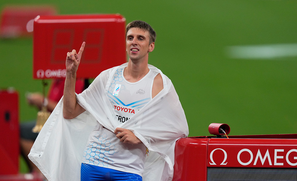 Dmitrii Safronov from Russia winning gold and beating world record during athletics at the Tokyo Paralympics, Tokyo Olympic Stadium, Tokyo, Japan