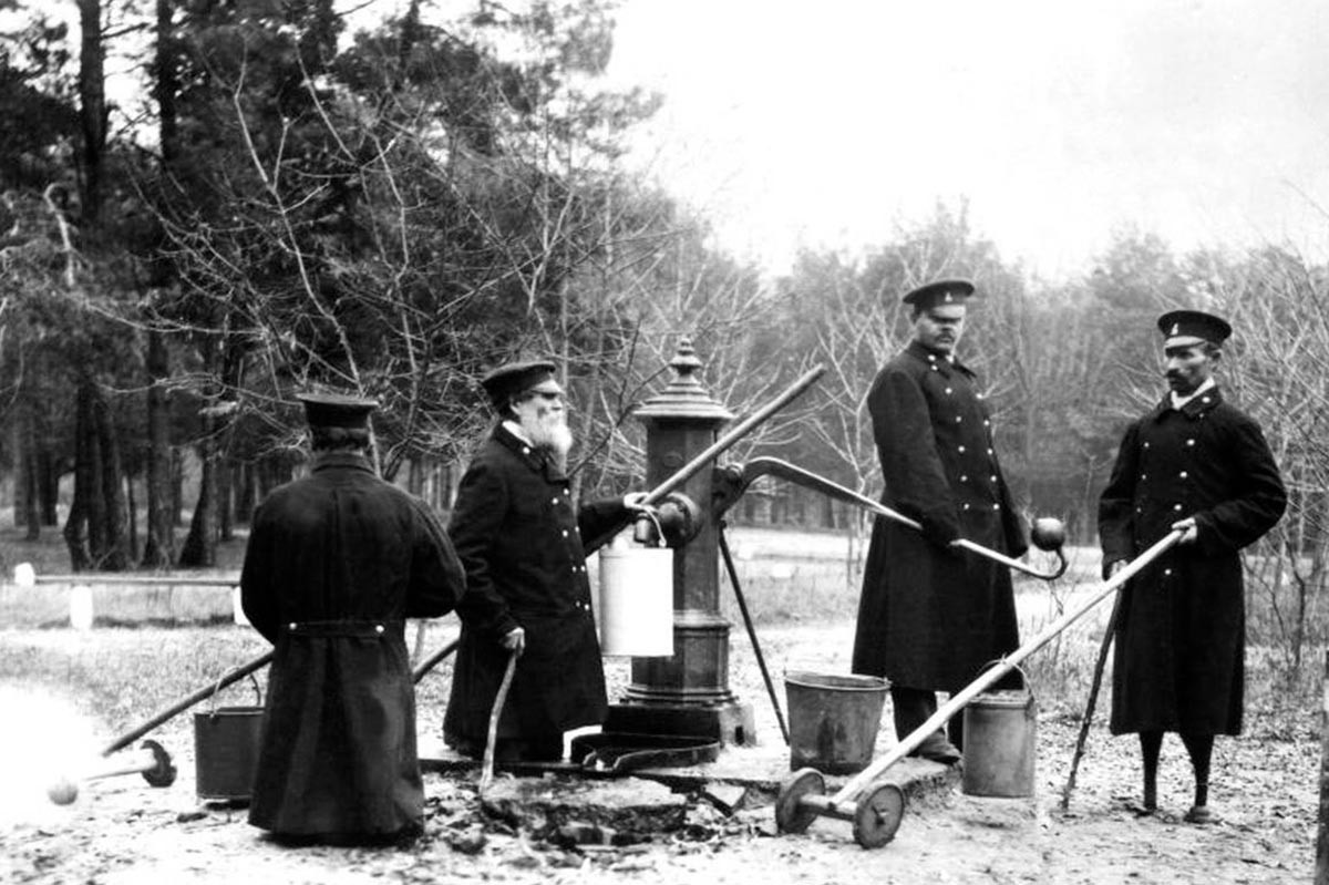 Disabled people at the well. The Western branch of the House of Emperor Alexander II for disabled railway employees. 1901.