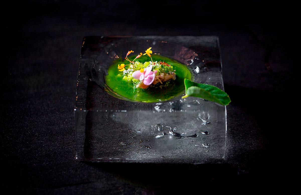 Okroshka with brine and white milk mushrooms in an ice dish.