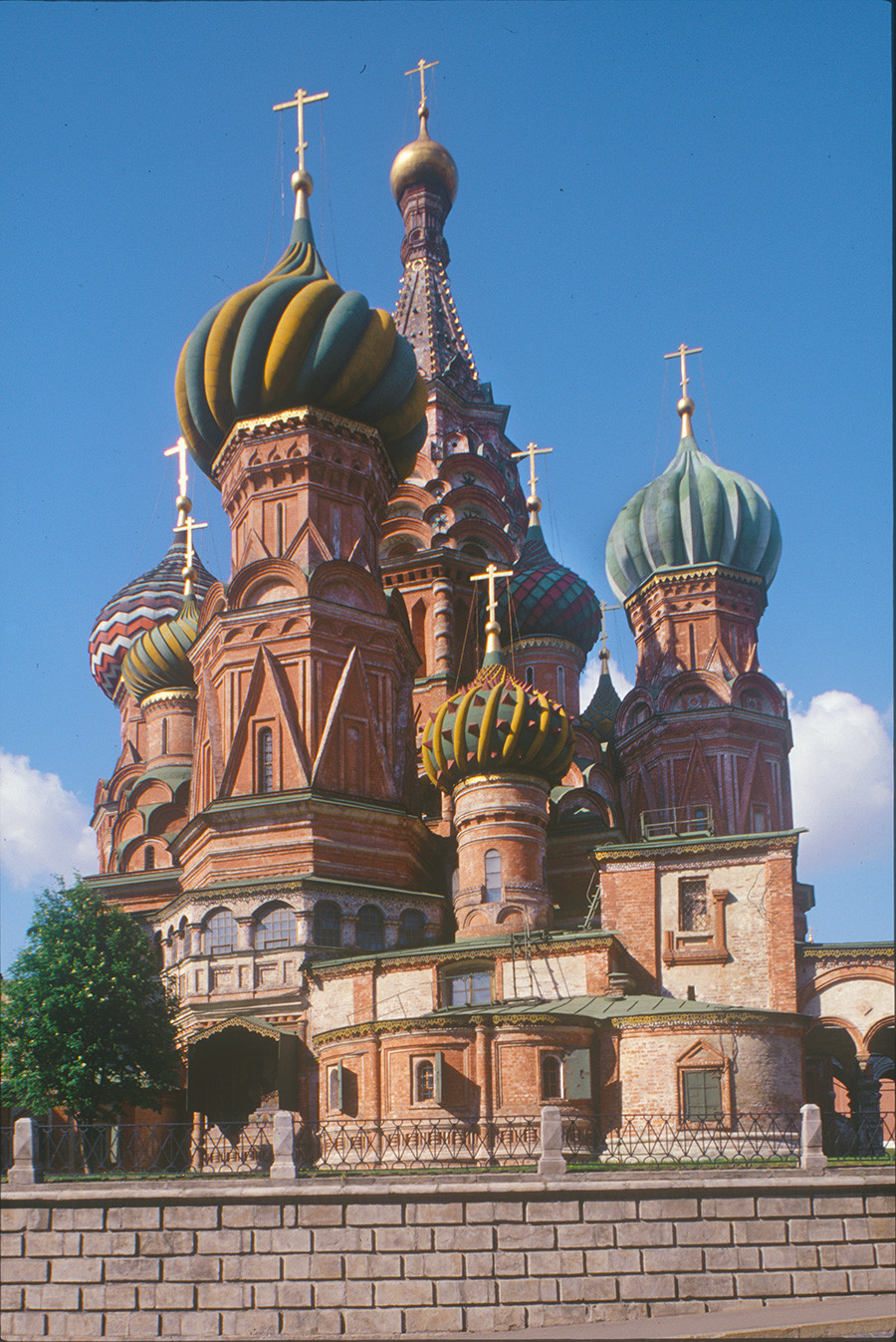 St. Basil's. Northeast view. From left center: Trinity Church, Church of Basil the Blessed, Church of Three Patriarchs (in shadow), Church of Sts. Cyprian & Justina. Background: Tower of Church of the Intercession. August 6, 1987