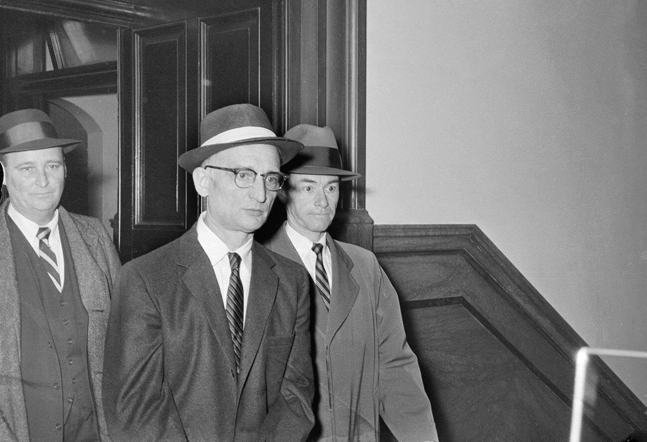 Soviet spy Rudolph Abel (left) leaves Federal Court here after being sentenced to 30 years in prison and fined $3,000 for conspiring to spy against the U.S.