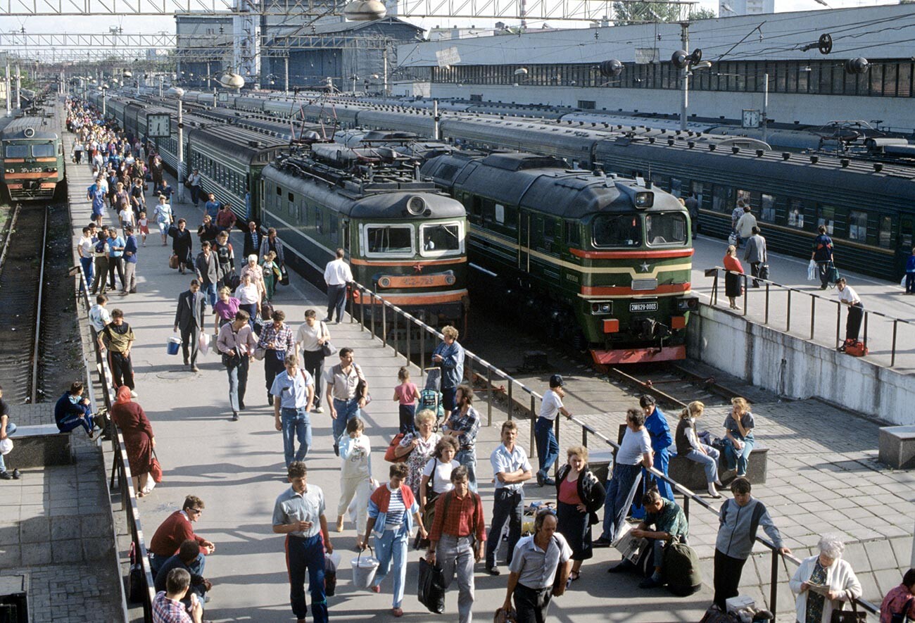 People in a Soviet railway station