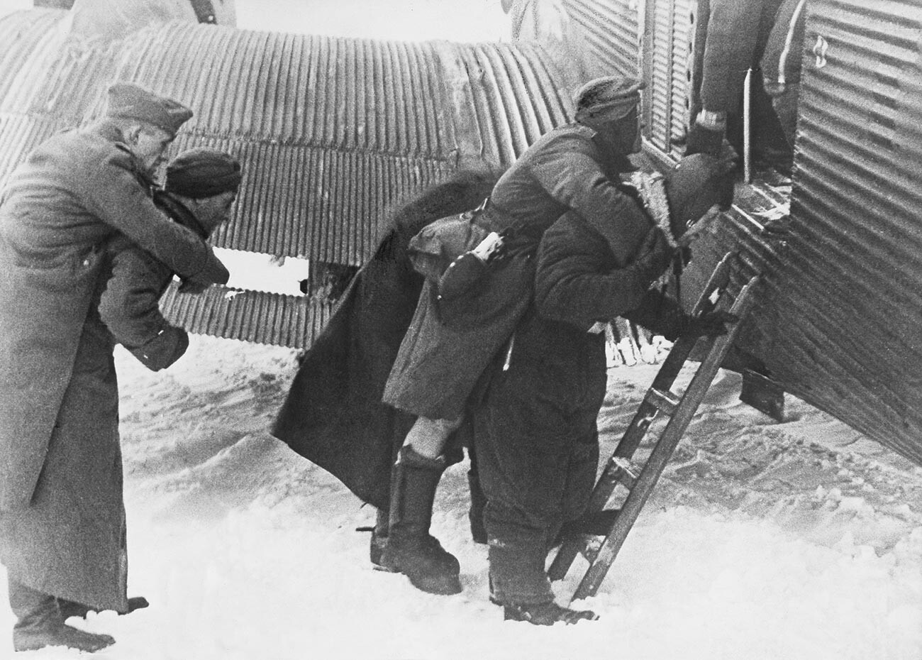 Wounded German soldiers loaded into a cargo plane Ju-52, Demyansk, 1942.