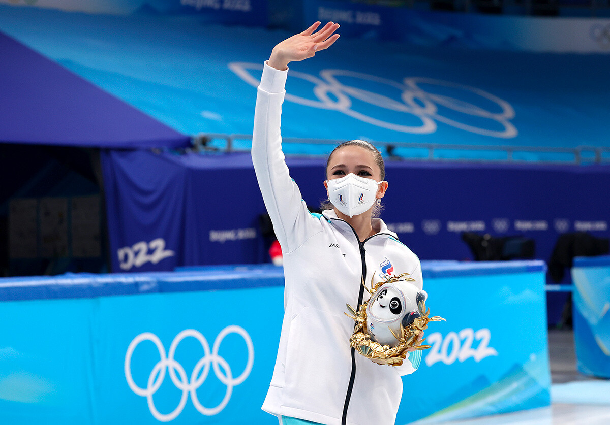 Gold medalists Kamila Valieva of Team ROC celebrate during the Team Event flower ceremony on day three of the Beijing 2022 Winter Olympic Games at Capital Indoor Stadium on February 07, 2022 in Beijing, China