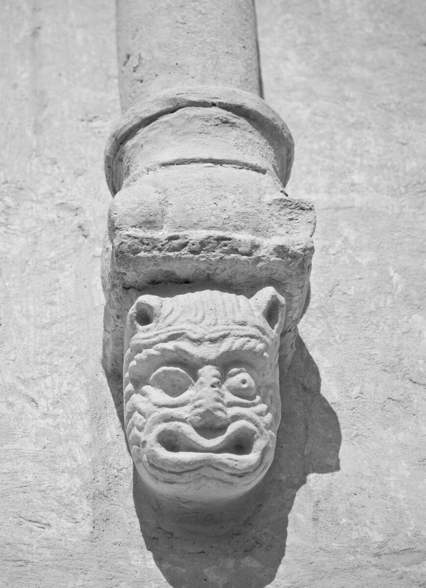 Church of the Intercession on the Nerl. West facade, arcade frieze column supported by console block with sculpted head of fanciful beast. July 18, 2009