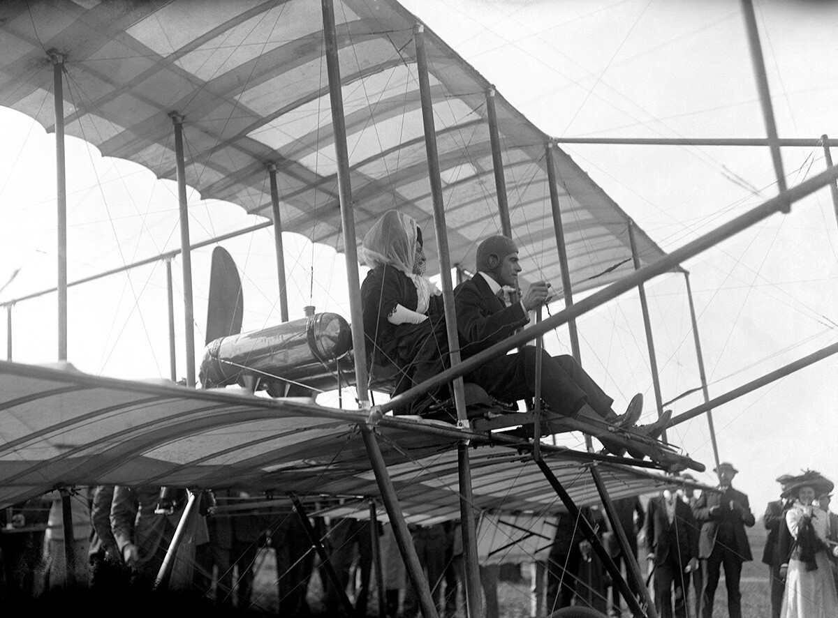 Claude Grahame White and Lady Abdy flying at Brooklands. The right to fly as a passenger was offered at auction, and Lady Abdy won with a bid of 120 guineas for the first trip. The aircraft crashed after 500 yards, but neither pilot or passenger were seriously injured