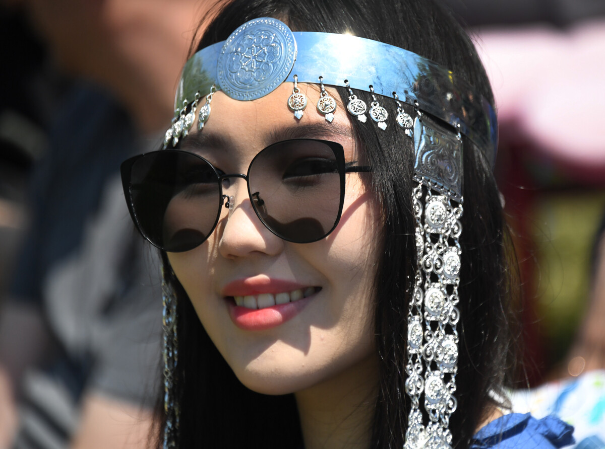 A young lady wearing traditional Yakut jewelry. 