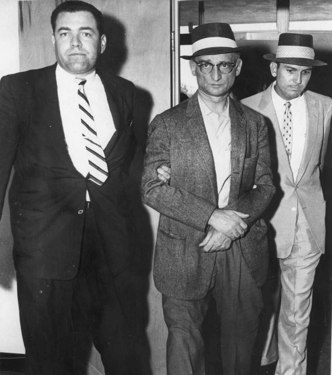 Rudolph Abel (center) arrives at court for his arraignment on espionage charges, New York, July 1957.