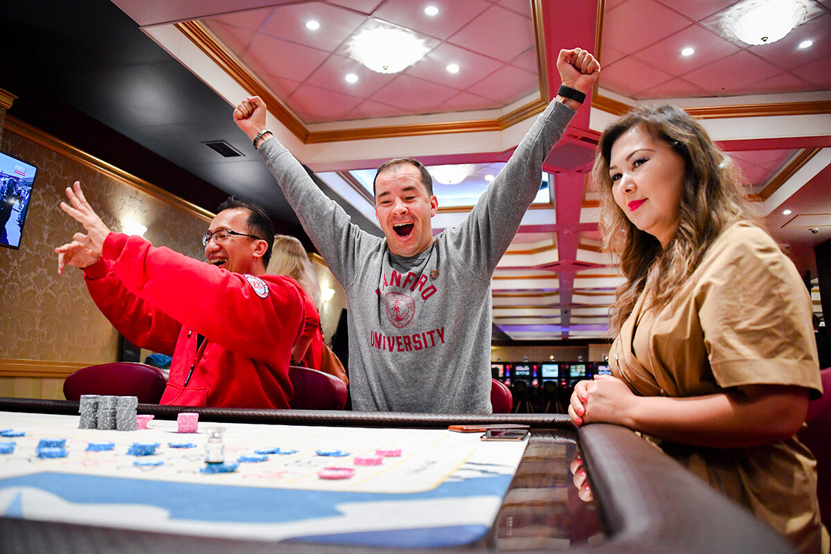 People playing the Roulette game at the Altay Palace casino in the Siberian Coin gambling zone. 