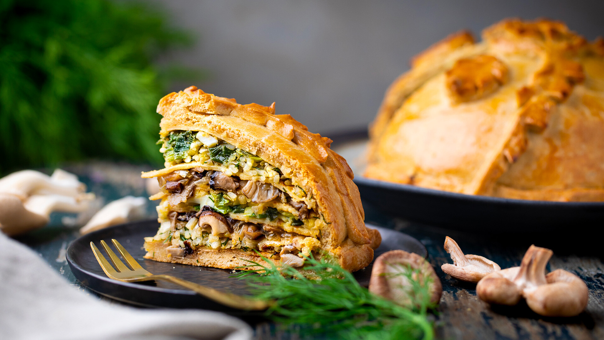 Homemade Russian pie Kurnik with chicken, potatoes and onions close-up on a  slate board on the table. horizontal Stock Photo - Alamy