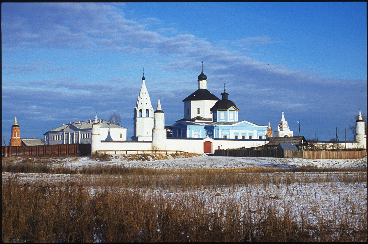 Old Bobrenevo. Bobrenev Nativity of the Virgin Monastery, southwest view. From left: walls & corner towers in Gothic Revival style, abbott's residence, bell tower & Cathedral of Nativity of the Virgin, Church of the St. Theodore Icon of the Virgin. December 26, 2003.