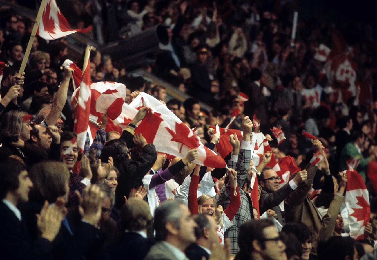 Some of the 3,000 Canadian fans cheer and wave the Canadian flag during the game between Canada and the Soviet Union in Game 6 of the 1972 Summit Series on September 24, 1972 at the Luzhniki Ice Palace in Moscow, Russia.