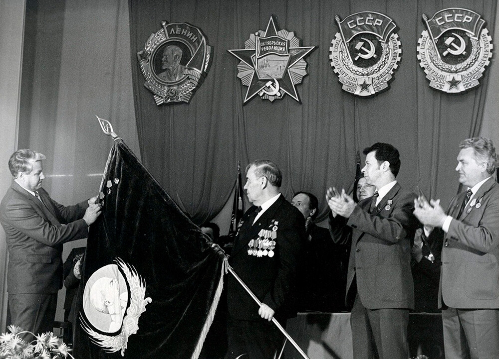 Boris Yeltsin as Secretary of the Sverdlovsk (Yekaterinburg) Party Committee presents the Order of the Red Banner of Labor to the Pervouralsk Factory