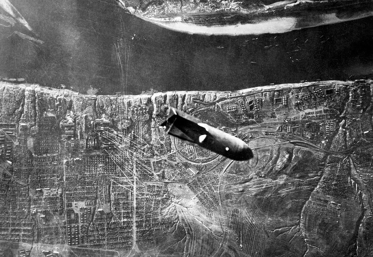 Aerial view of a bomb being dropped on an industrial chemical plant in the city of Stalingrad.