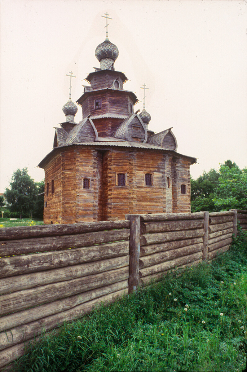 Church of the Transfiguration, east view with apse. From Kozlyatevo village, Kolchuginsky Region. Foreground: solid log fence. June 18, 1994