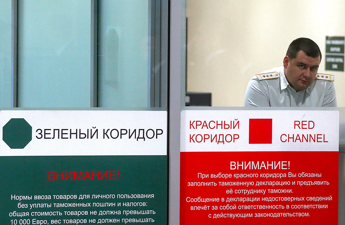 An officer of the Russian Customs Service in the international arrivals hall of Domodedovo airport.