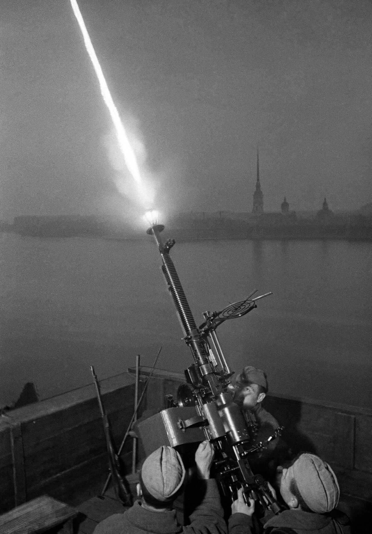 Soviet anti-aircraft gunners fire at enemy planes.