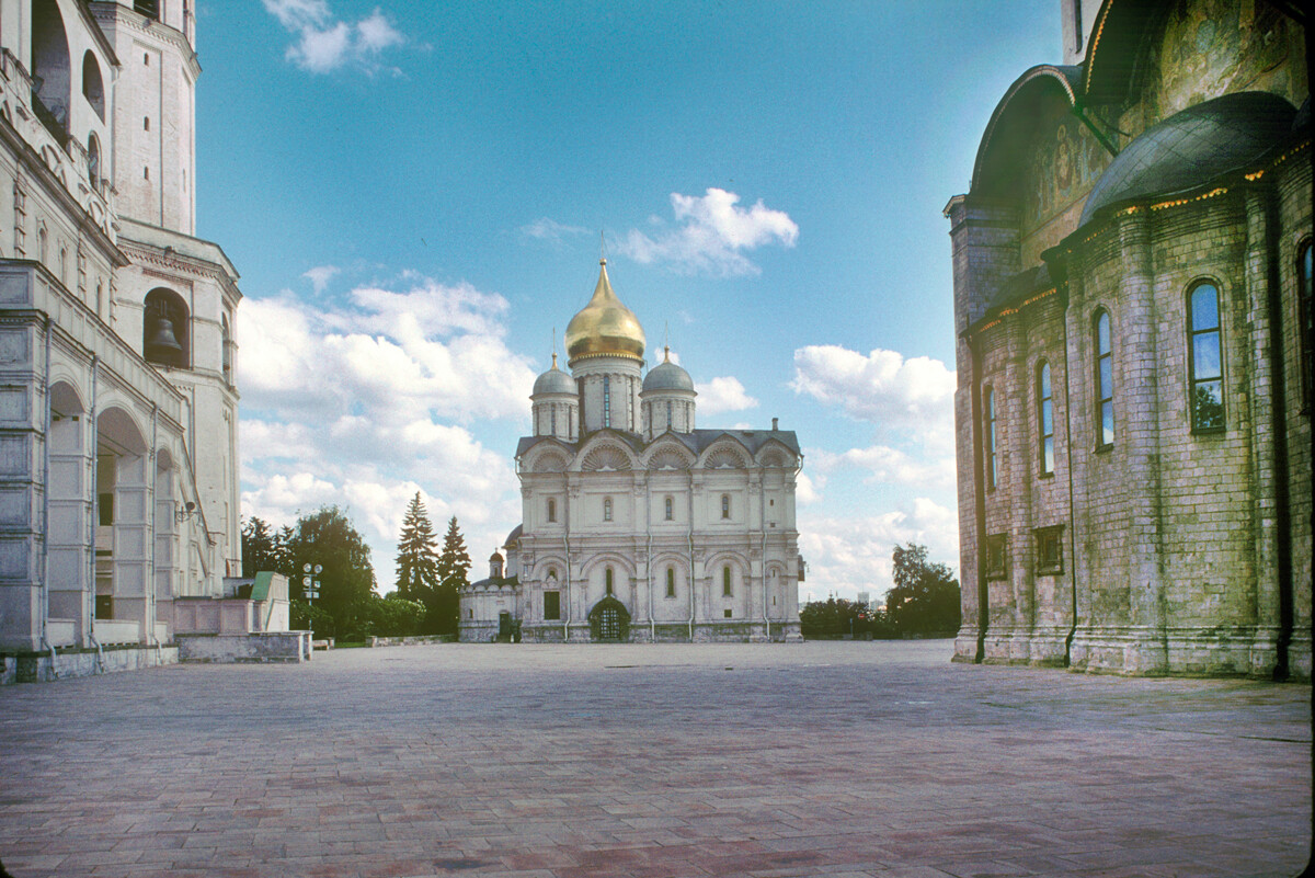 Cathedral of Archangel Michael. North view across Cathedral Square with Bell Tower of Ivan the Great (left) & Dormition Cathedral, east facade. June 17, 1994