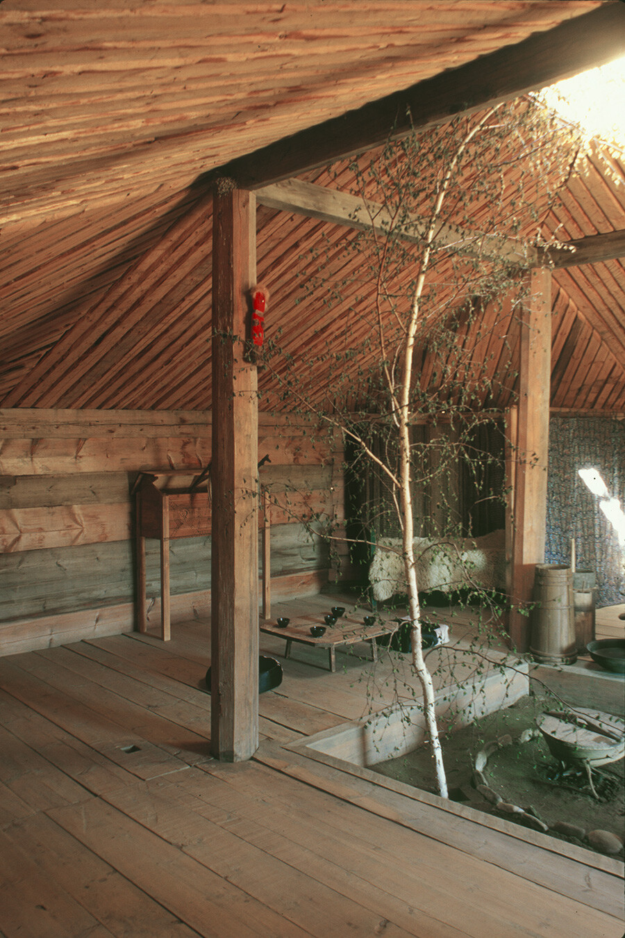 Taltsy. Interior of Buriat yurt with plank roof. Hearth in center. October 2, 1999