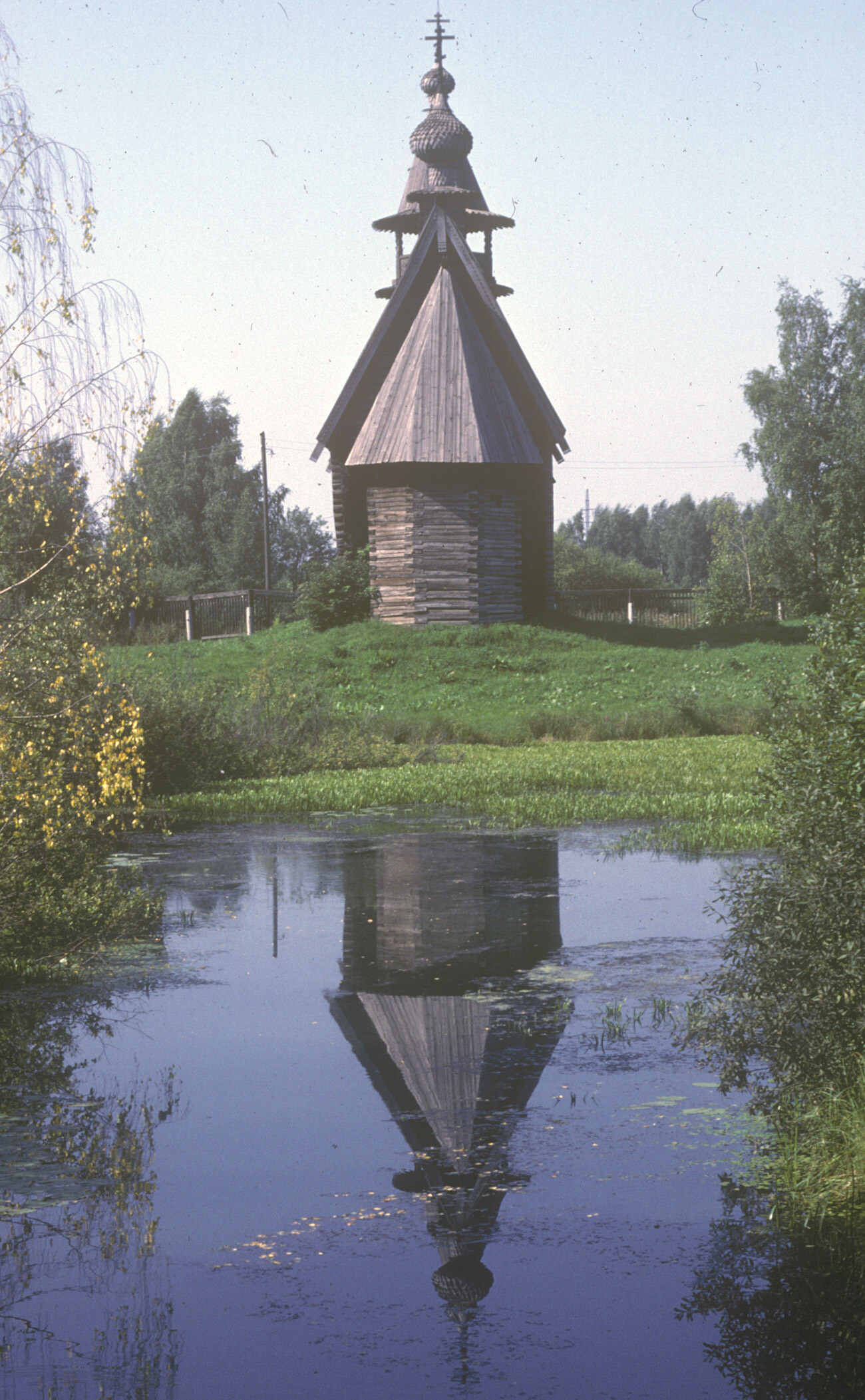 Church of the Icon of Most Merciful Savior, from Fominskoe village. East view with reflection in pond. August 22, 1988