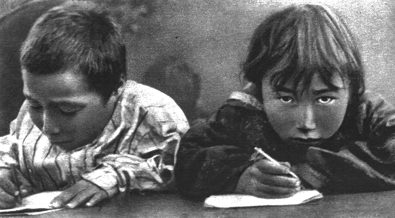 Young Chukhi students in school.