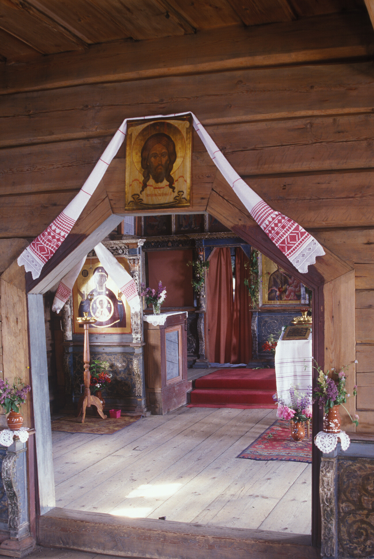 Church of the Dormition. Interior, portal from refectory to main worship space. Note embroidered cloth protecting Miraculous Icon of the Savior. July 4, 2000