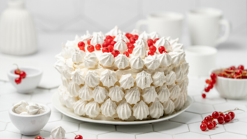 Airy meringue, delicate cream and the sour taste of berries - this cake is a heavenly delight.
