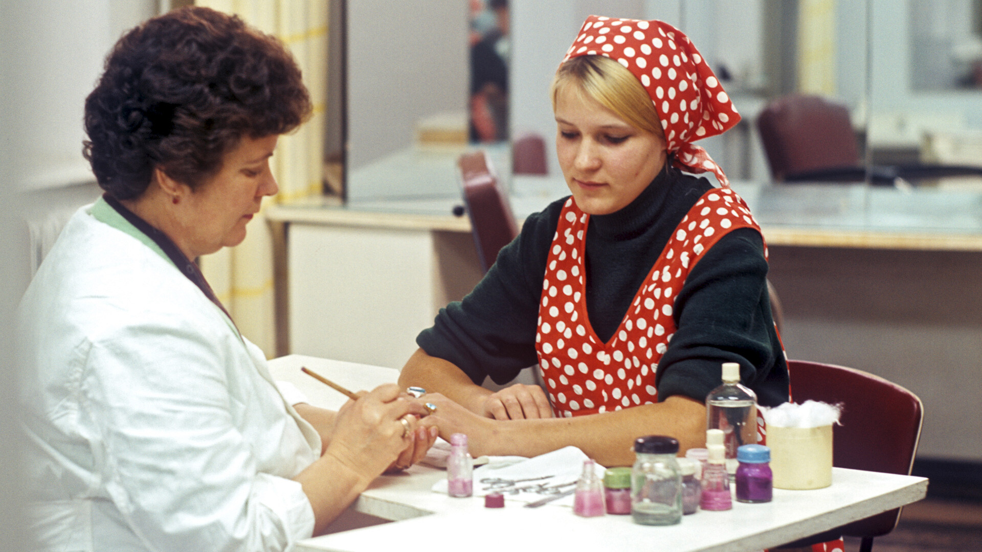 A factory worker in the cosmetic office. 1975.